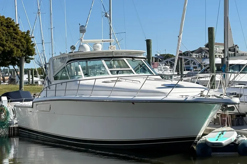Mokai Yacht Photos Pics 1996 Tiara 4300 Open yacht docked at marina, clear sky background.