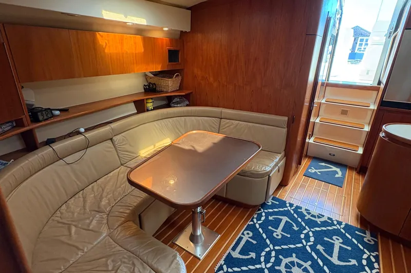 Mokai Yacht Photos Pics Interior of 1996 Tiara 4300 Open yacht with cozy seating and nautical decor.