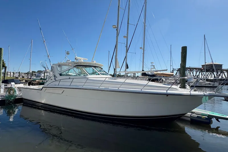 Mokai Yacht Photos Pics 1996 Tiara 4300 Open yacht docked at marina under clear blue sky.