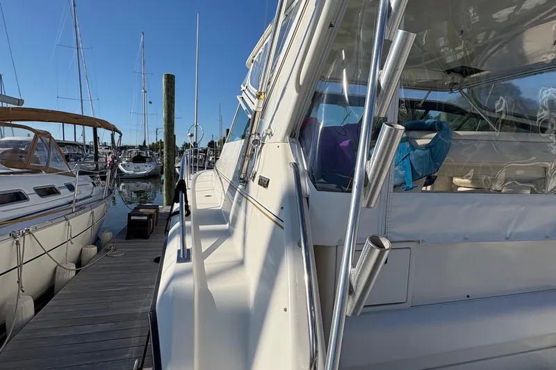 Mokai Yacht Photos Pics 1996 Tiara 4300 Open yacht docked at marina under clear blue sky.