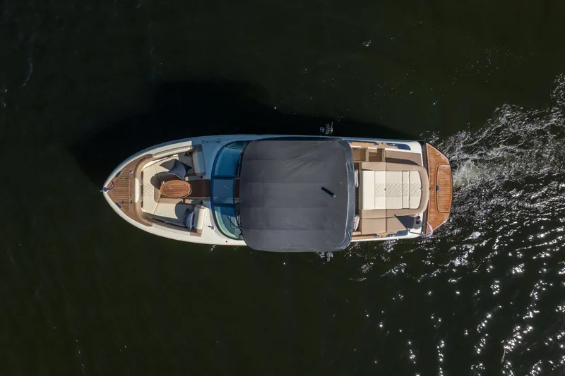  Yacht Photos Pics Overhead view of 2026 Chris-Craft Sportster 28 boat cruising on water.