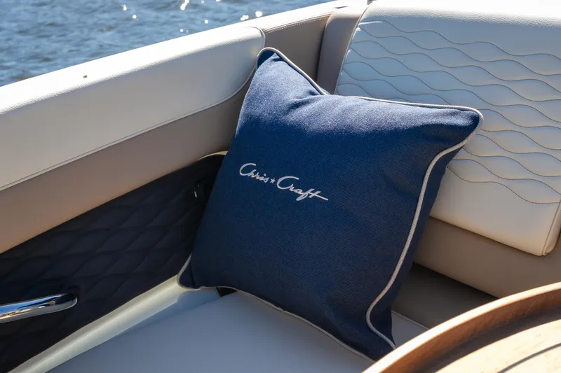  Yacht Photos Pics Luxurious interior of 2026 Chris-Craft Sportster 28 with branded blue cushion.
