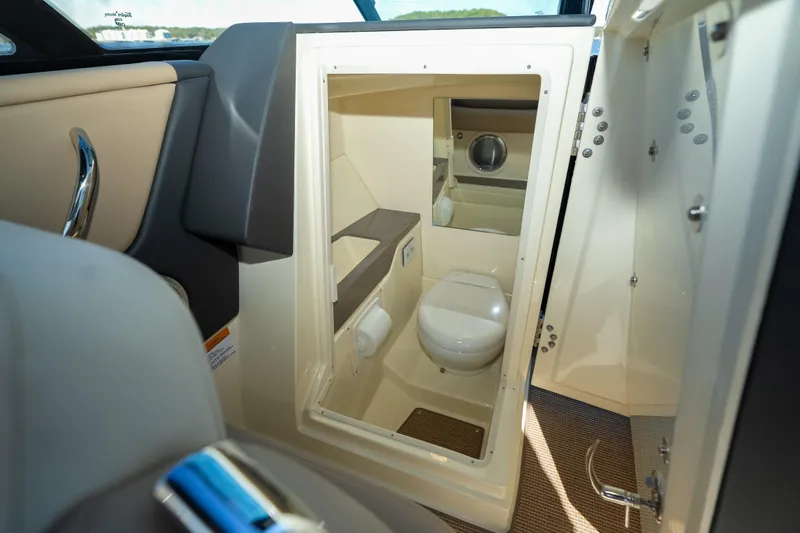  Yacht Photos Pics 2026 Chris-Craft Sportster 28 boat interior, featuring a compact bathroom with modern amenities.