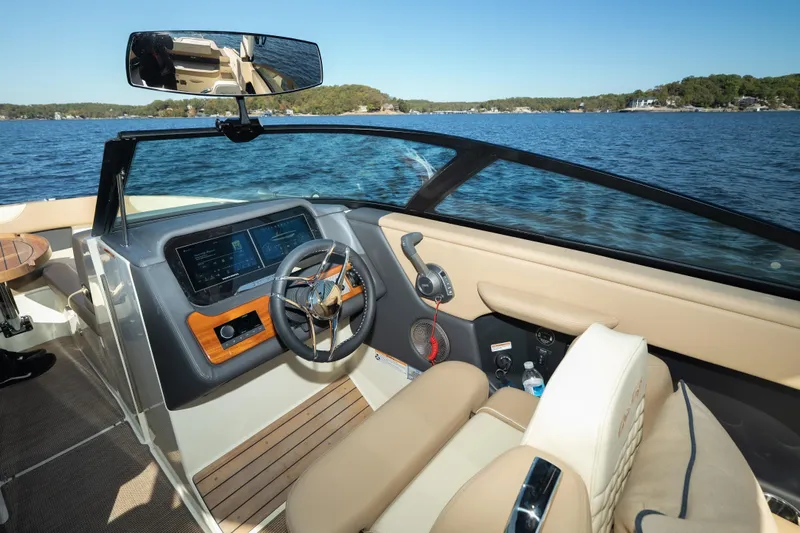  Yacht Photos Pics Interior of 2026 Chris-Craft Sportster 28 boat with modern dashboard and steering wheel.