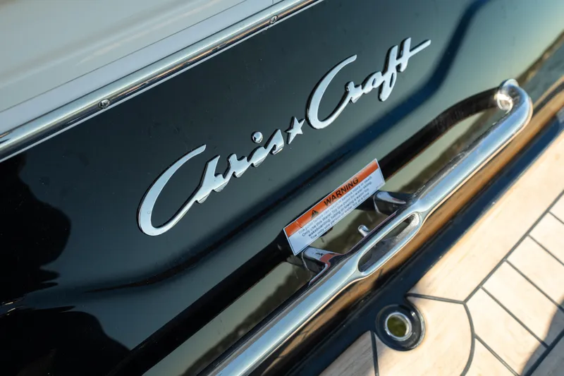  Yacht Photos Pics 2026 Chris-Craft Sportster 28 boat logo and warning label on deck.