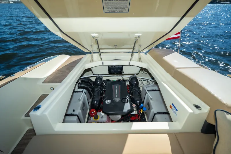  Yacht Photos Pics 2026 Chris-Craft Sportster 28 engine compartment open, showcasing powerful marine engine.