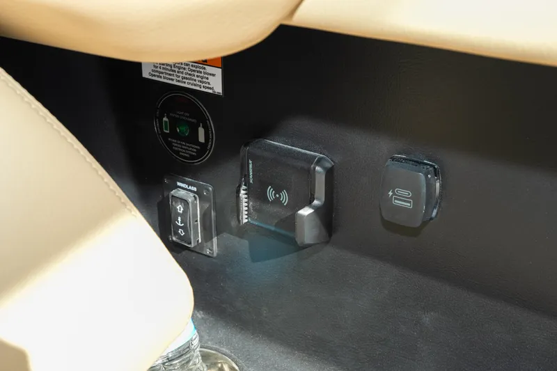  Yacht Photos Pics Control panel of 2026 Chris-Craft Sportster 28 with wireless charging and windlass switch.