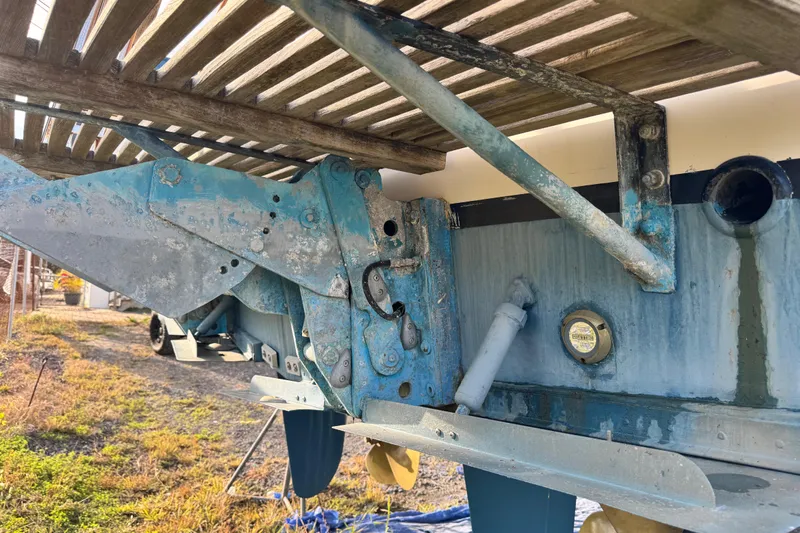 Driftwood Yacht Photos Pics Close-up of the underside of a 2000 Grand Banks 52 Europa boat, showing propeller and rudder.