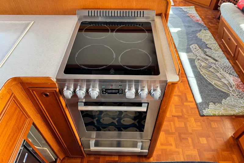 Driftwood Yacht Photos Pics Stainless steel stove in a 2000 Grand Banks 52 Europa yacht kitchen.