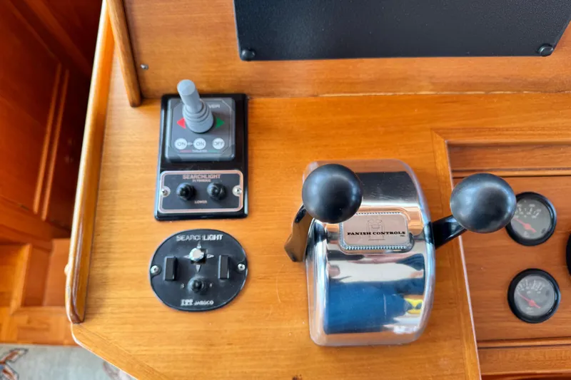 Driftwood Yacht Photos Pics Control panel of 2000 Grand Banks 52 Europa yacht with searchlight and throttle controls.