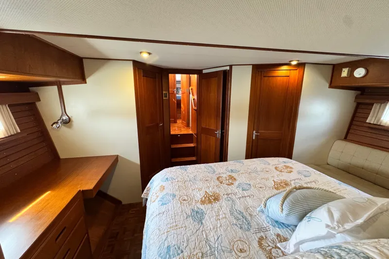 Driftwood Yacht Photos Pics Luxurious cabin interior of 2000 Grand Banks 52 Europa yacht with elegant wood finish.