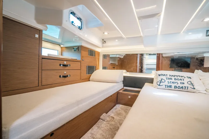  Yacht Photos Pics Interior of 2021 Jeanneau Leader 12.5 WA boat with cozy cabin and stylish decor.