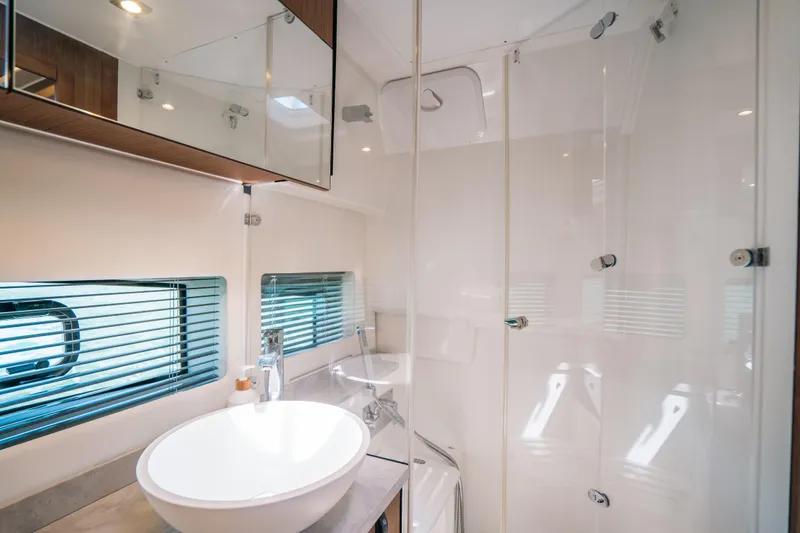  Yacht Photos Pics Modern bathroom interior on 2021 Jeanneau Leader 12.5 WA yacht with glass shower.