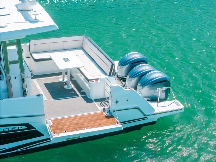  Yacht Photos Pics 2021 Jeanneau Leader 12.5 WA boat with twin engines on turquoise water.