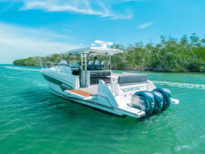  Yacht Photos Pics 2021 Jeanneau Leader 12.5 WA cruising on clear blue water.