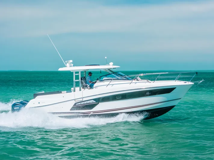  Yacht Photos Pics 2021 Jeanneau Leader 12.5 WA cruising on turquoise waters.