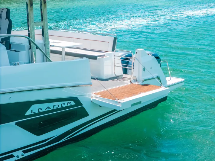  Yacht Photos Pics 2021 Jeanneau Leader 12.5 WA boat docked on clear turquoise water.