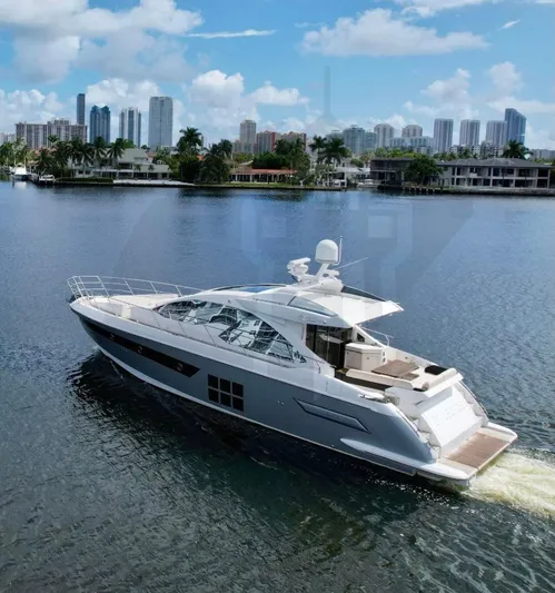 Saint George Yacht Photos Pics 2015 Azimut 55S yacht cruising on a scenic waterfront with city skyline.