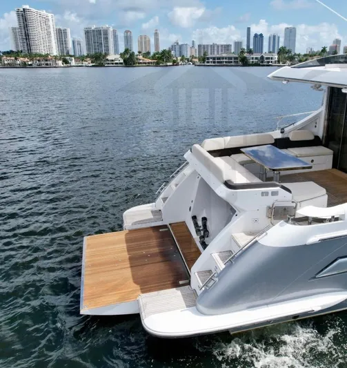 Saint George Yacht Photos Pics 2015 Azimut 55S yacht with open deck, city skyline in background.
