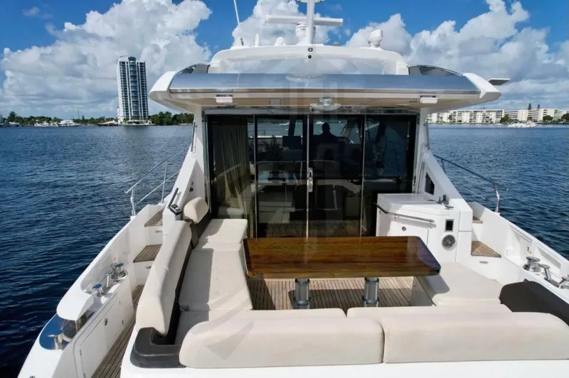 Saint George Yacht Photos Pics 2015 Azimut 55S yacht with spacious deck and seating, cruising on a sunny day.