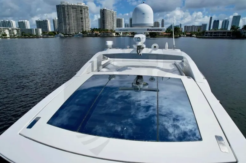 Saint George Yacht Photos Pics Azimut 55S 2015 yacht on water with city skyline in background.