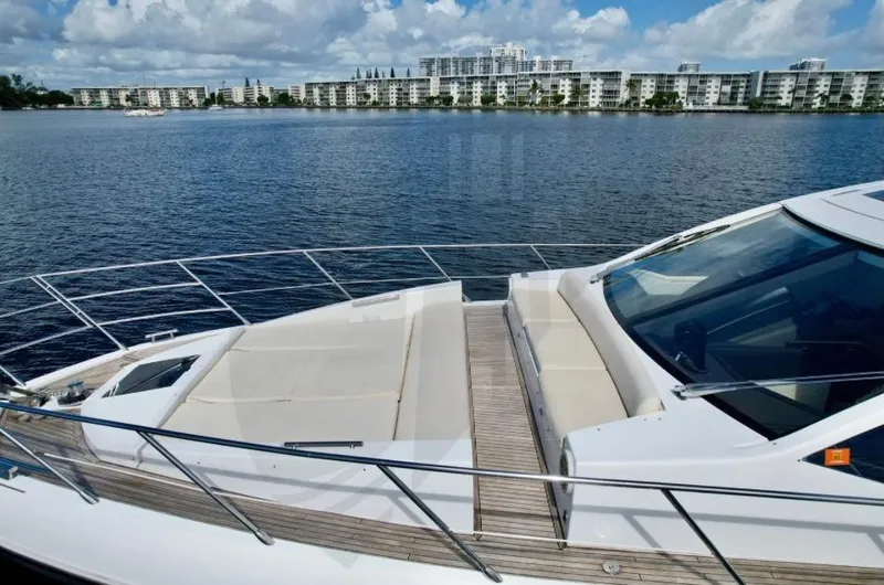 Saint George Yacht Photos Pics Azimut 55S 2015 yacht on calm water with cityscape background.