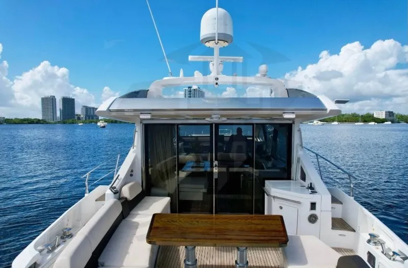 Saint George Yacht Photos Pics 2015 Azimut 55S yacht on calm water, featuring spacious deck and modern design.