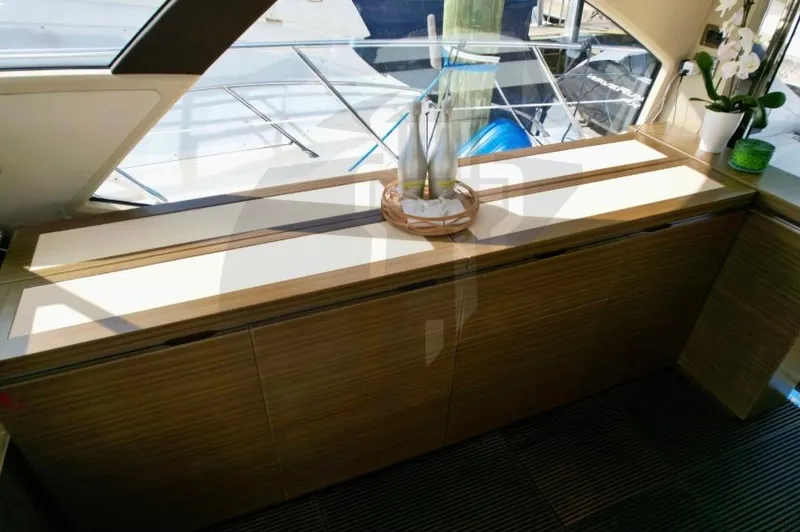 Saint George Yacht Photos Pics Interior of 2015 Azimut 55S yacht with elegant wooden cabinetry and decor.
