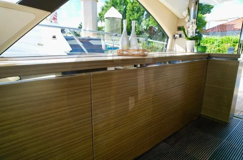 Saint George Yacht Photos Pics Luxurious interior of 2015 Azimut 55S yacht with sleek wooden cabinetry.