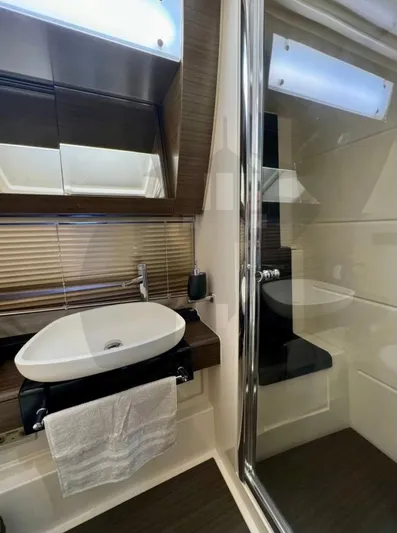 Saint George Yacht Photos Pics Luxurious bathroom in 2015 Azimut 55S yacht with modern sink and mirror.