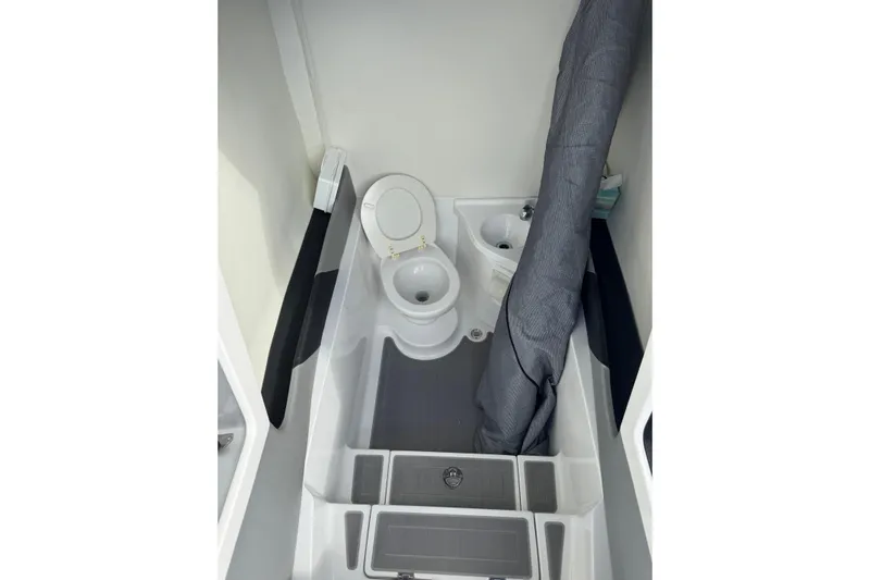  Yacht Photos Pics Compact bathroom in 2019 Statement 380 Open boat, featuring toilet and sink.
