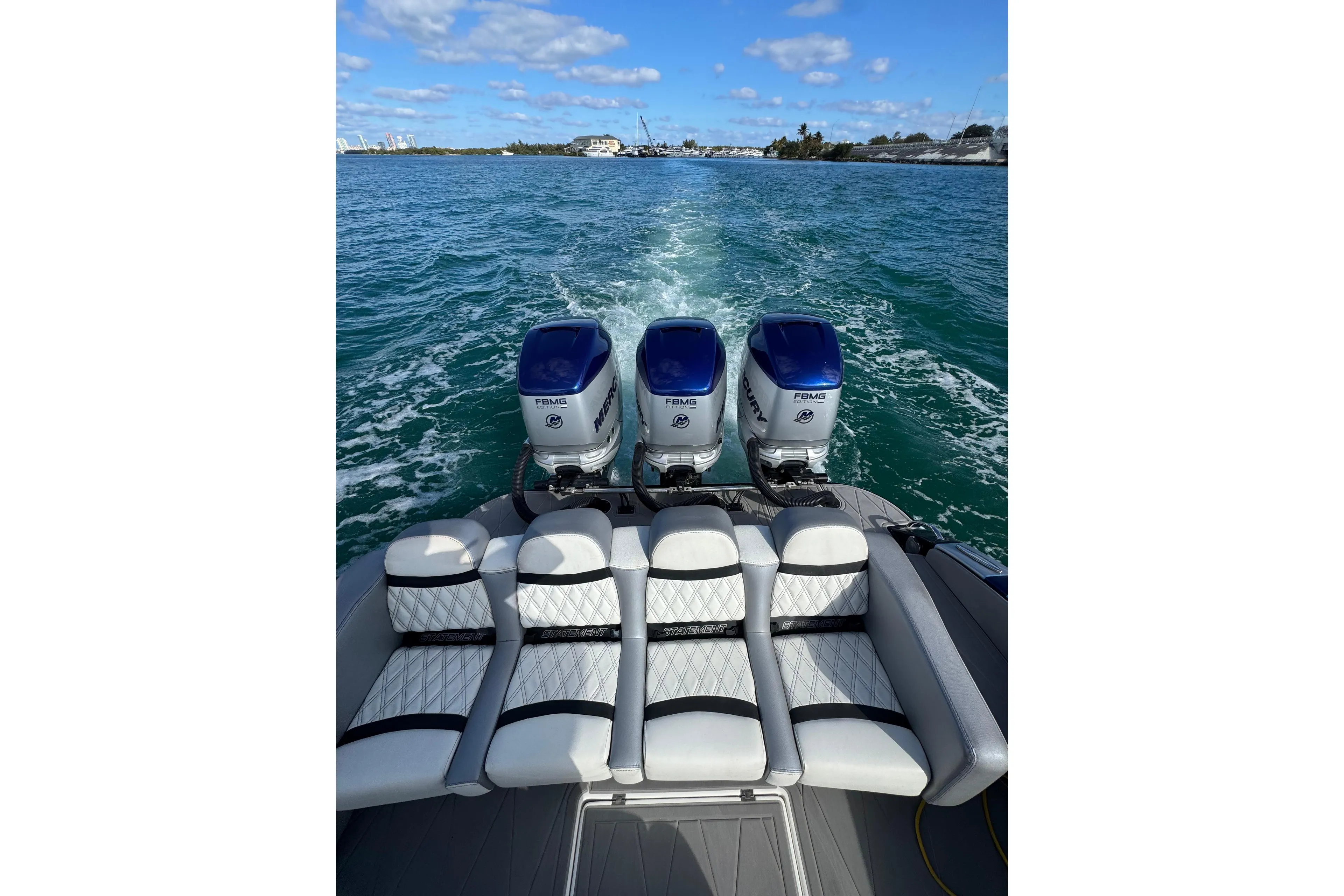 2019 Statement 380 Open boat with triple Mercury engines on open water.