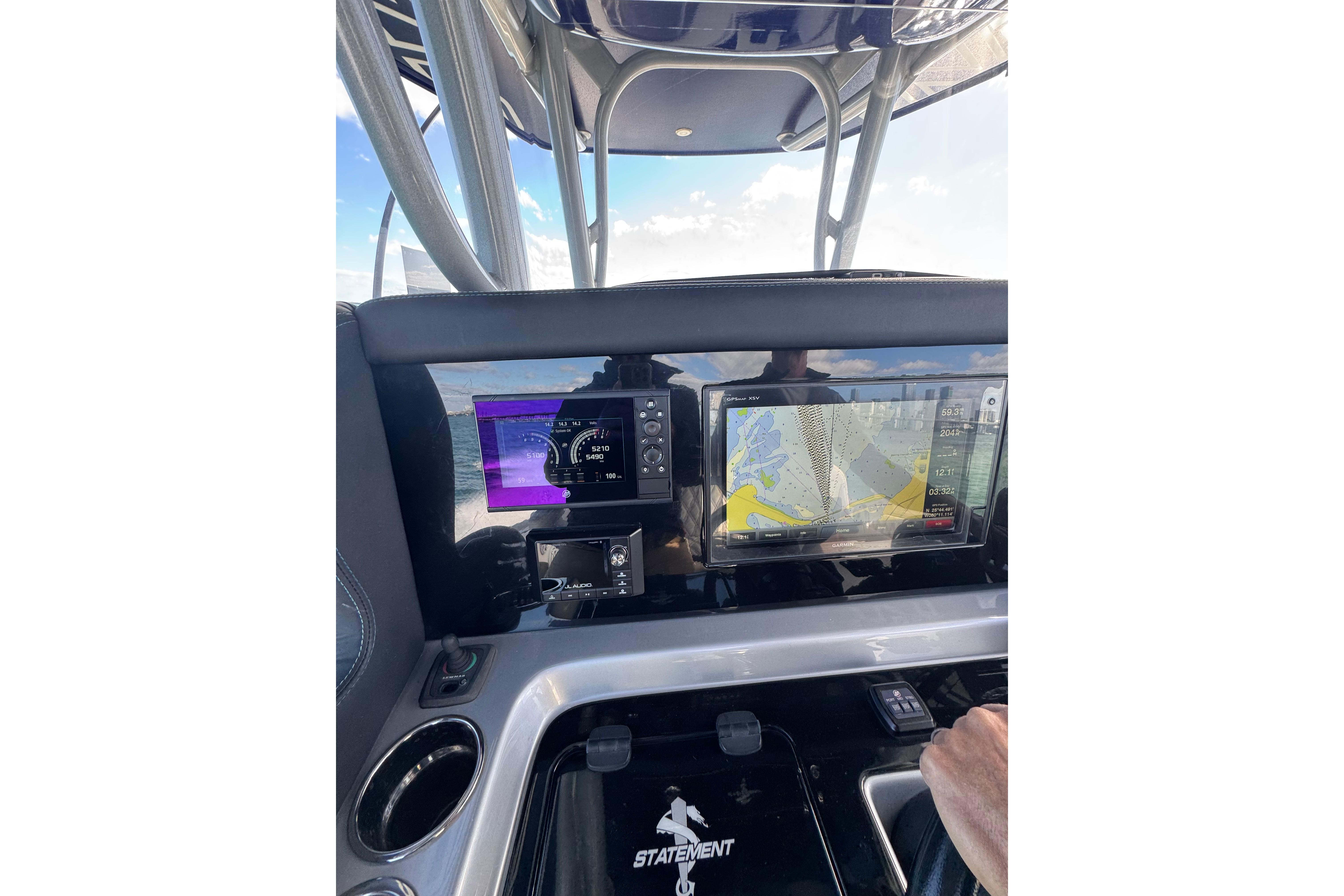 Dashboard of 2019 Statement 380 Open boat with navigation screens and controls.