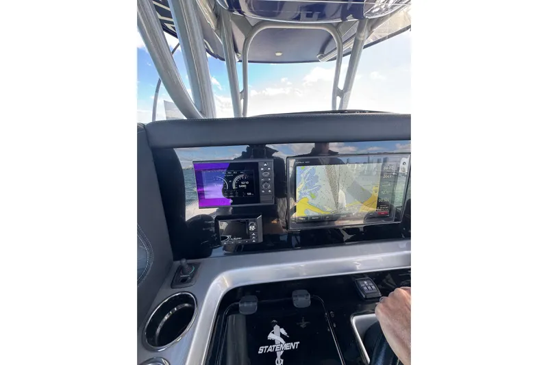  Yacht Photos Pics Dashboard of 2019 Statement 380 Open boat with navigation screens and controls.