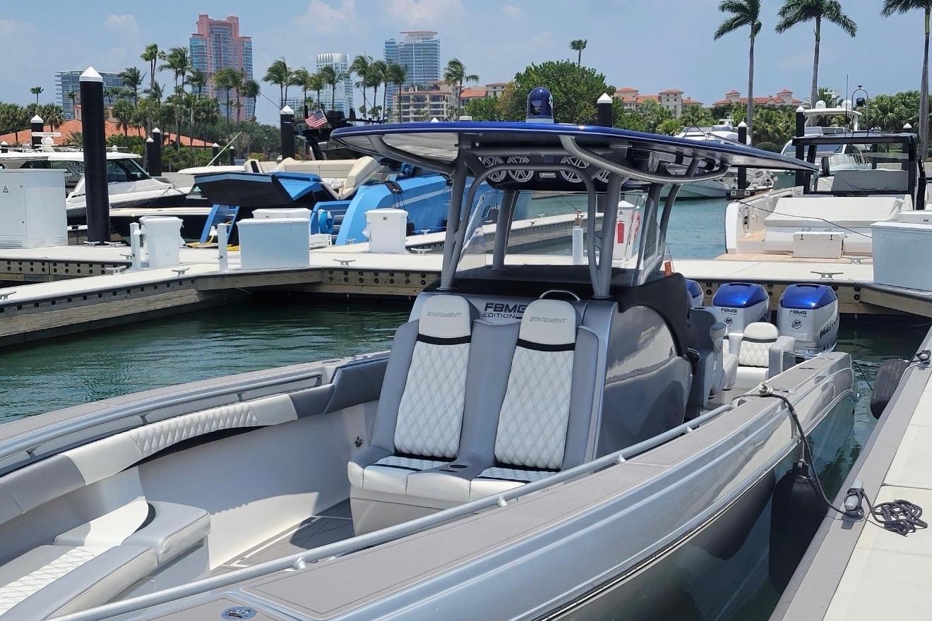 2019 Statement 380 Open boat docked at marina with luxury seating and twin engines.
