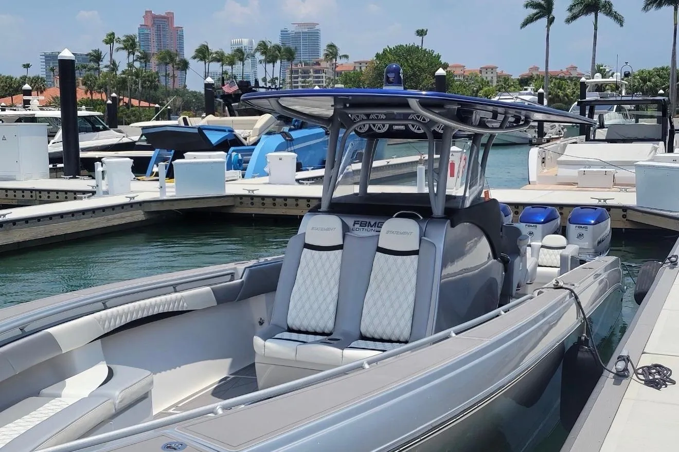 2019 Statement 380 Open boat docked at marina with luxury seating and twin engines.