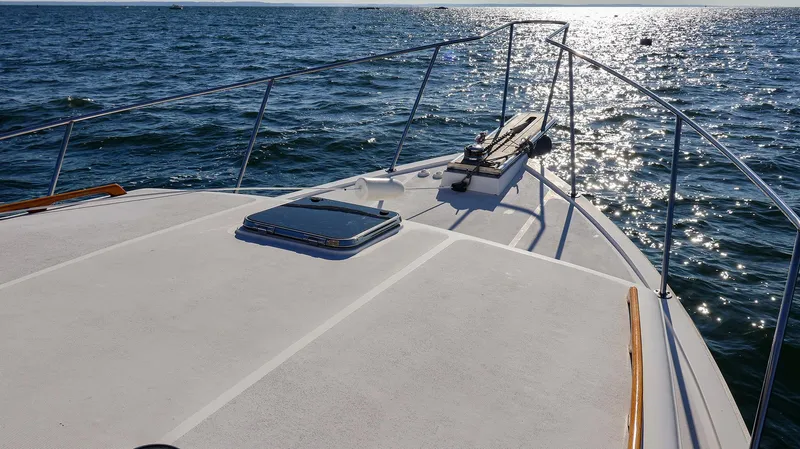 4804mm Yacht Photos Pics 2008 Fortier 33 boat deck on sunny ocean waters.