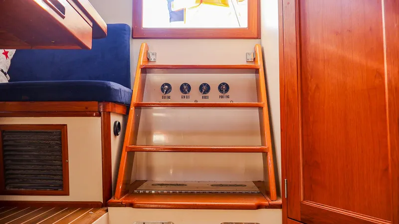 4804mm Yacht Photos Pics Interior of 2008 Fortier 33 boat with wooden steps and seating.