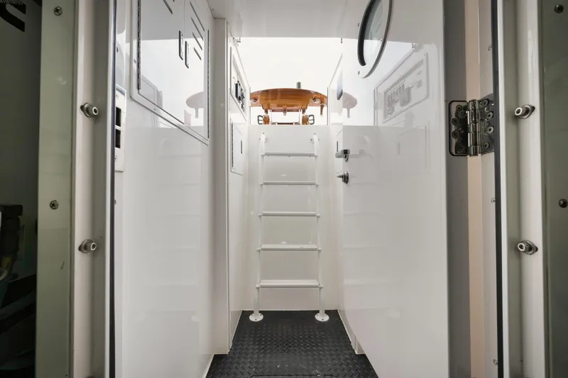 Cookie Monster Yacht Photos Pics Interior view of 2017 Viking Sky Bridge yacht with ladder and white walls.