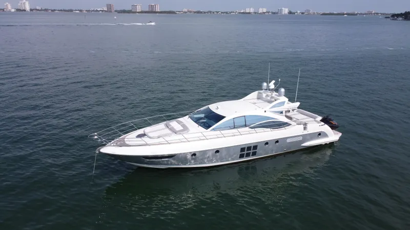 Life Is Great Yacht Photos Pics 2007 Azimut 62S yacht cruising on open water, showcasing sleek design and luxury.