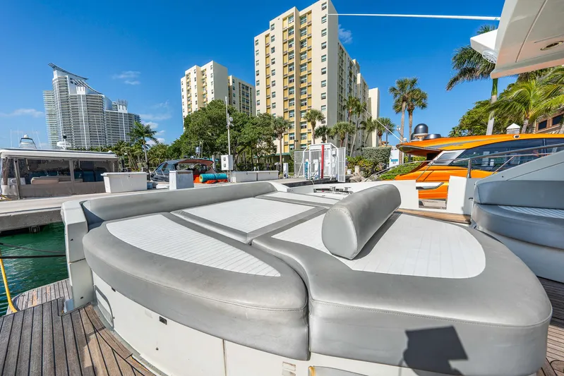 Life Is Great Yacht Photos Pics Luxurious 2007 Azimut 62S yacht with spacious sunbathing area, docked in a vibrant marina.