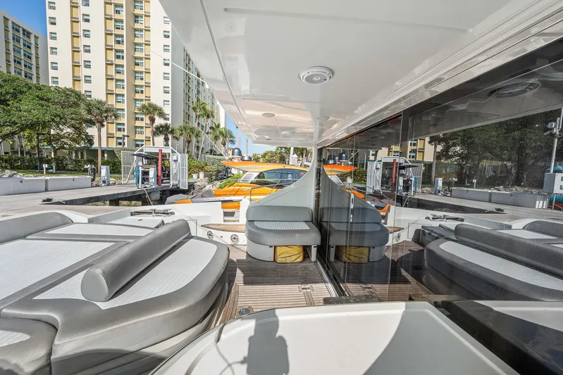 Life Is Great Yacht Photos Pics 2007 Azimut 62S yacht with sleek seating and modern design at a marina.