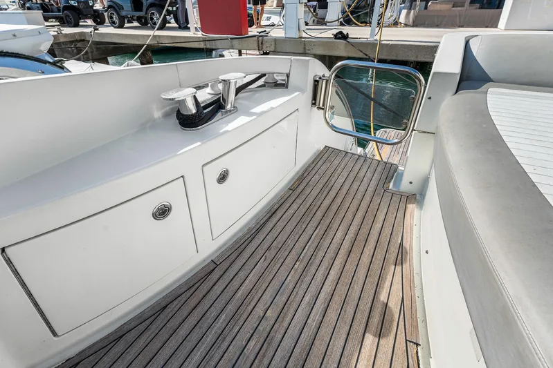 Life Is Great Yacht Photos Pics 2007 Azimut 62S yacht deck with teak flooring and storage compartments.