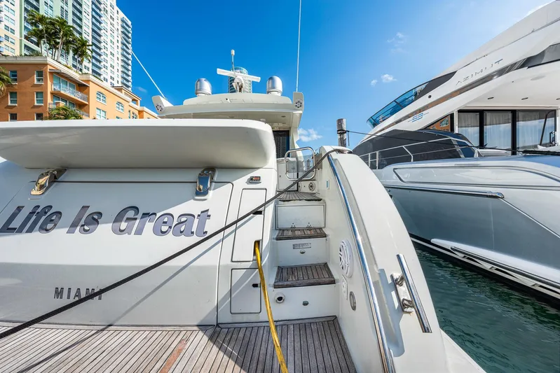 Life Is Great Yacht Photos Pics 2007 Azimut 62S yacht docked, featuring "Life Is Great" text, Miami backdrop.