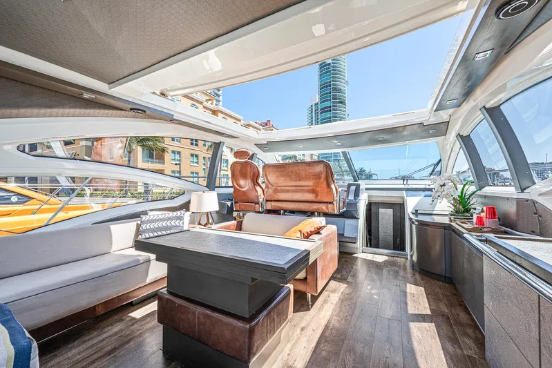 Life Is Great Yacht Photos Pics Luxurious interior of a 2007 Azimut 62S yacht with modern furnishings and panoramic windows.