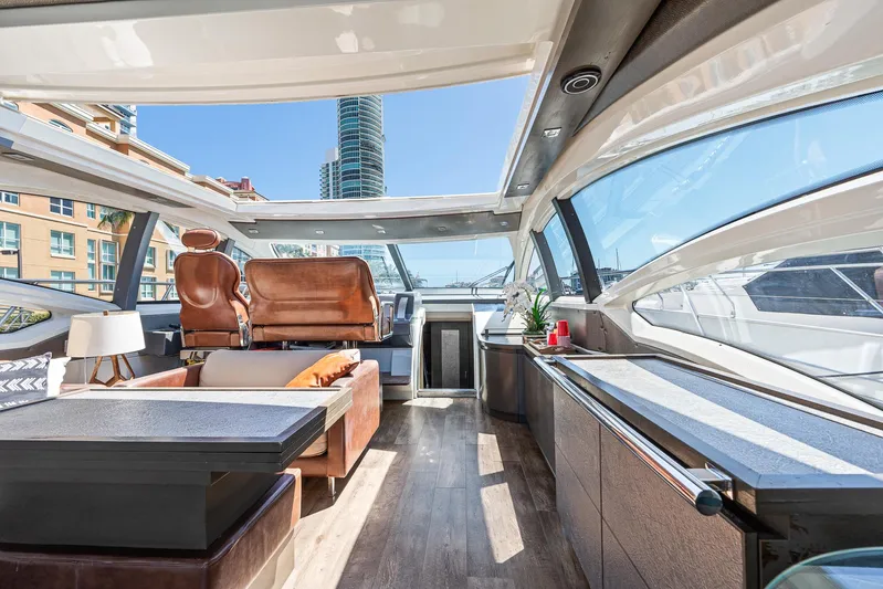 Life Is Great Yacht Photos Pics Luxurious interior of a 2007 Azimut 62S yacht with modern furnishings and panoramic windows.