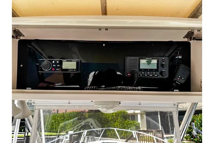  Yacht Photos Pics 1999 Intrepid 356 boat dashboard with radio and navigation equipment.