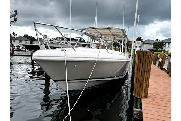  Yacht Photos Pics 1999 Intrepid 356 boat docked under cloudy skies.