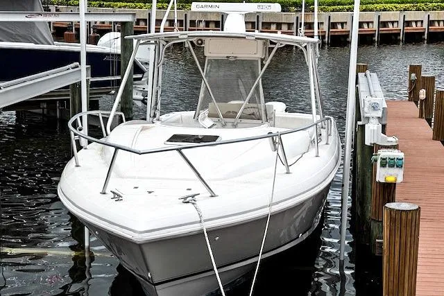  Yacht Photos Pics 1999 Intrepid 356 boat docked at marina with white hull and canopy.