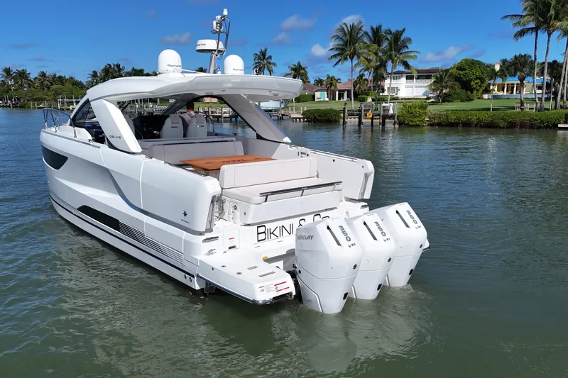  Yacht Photos Pics 2024 Jeanneau DB43 yacht with triple Mercury outboard engines on a sunny day.